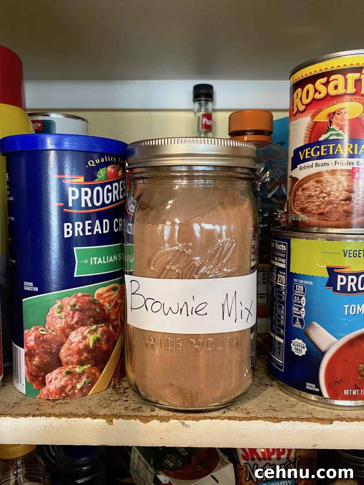 Homemade Brownie Mix Recipe for Fudgy Chocolate Brownies 7 A jar of brownie mix on a pantry shelf.