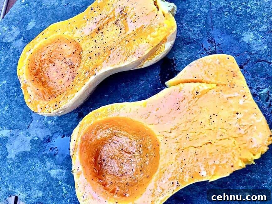 Halved squash seasoned with extra virgin olive oil, salt, and pepper.