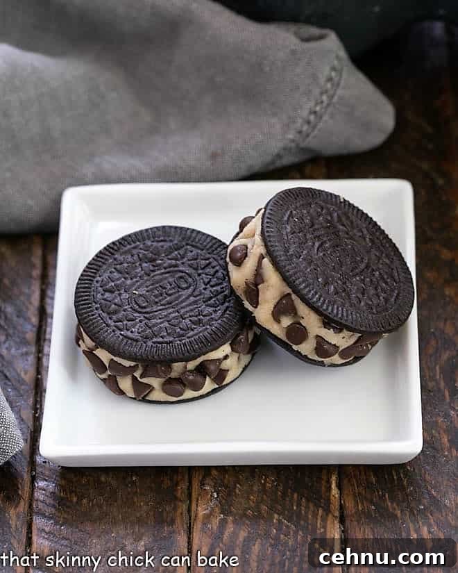 Oreo Cookie Dough Dessert - An easy semi-homemade recipe made with safe, edible cookie dough nestled in an Oreo Cookie 2 cookie dough stuffed Oreos on a square white plate.