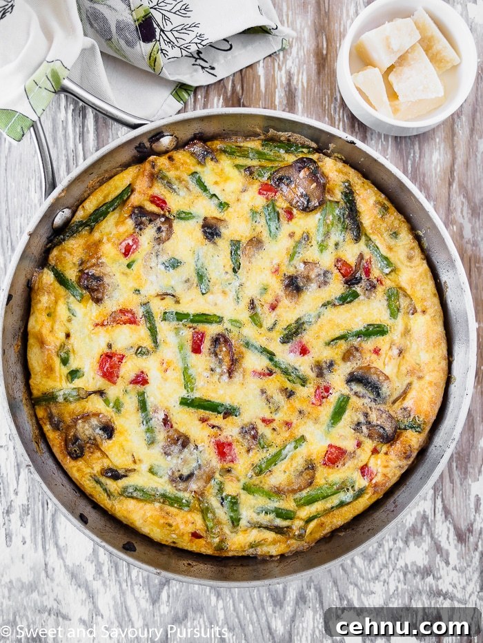 Vegetable Frittata with Spinach and Cherry Tomatoes 2 A Healthy Vegetable Frittata in a skillet.