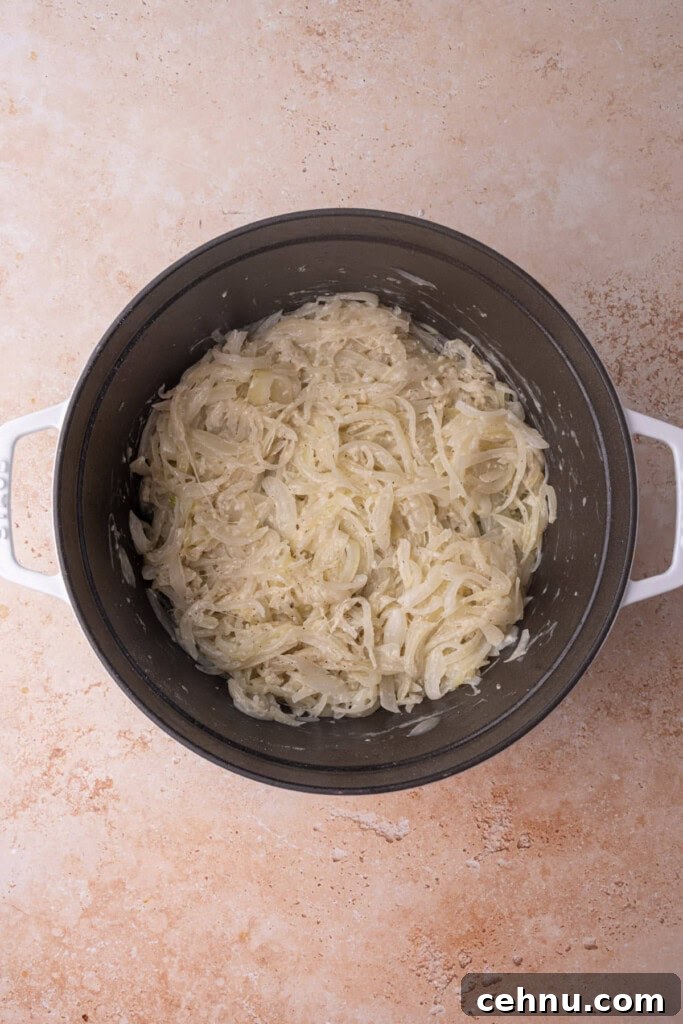 Cooked onions with butter, flour, salt, and pepper to make a roux for soup.