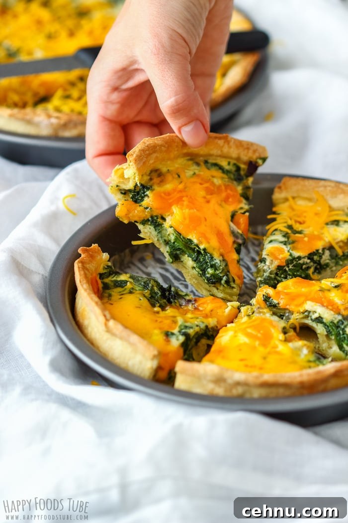 Spinach and Cheddar Quiche slice on hand